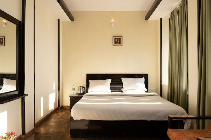 Imagen de la habitación del Hotel Rhodo Inn. Foto 14