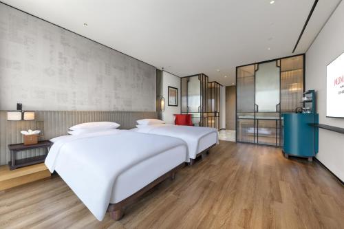 Imagen de la habitación del Hotel RiZhao Mumian. Foto 16