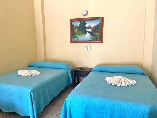 Imagen de la habitación del Hotel Ricardos Bungalows. Foto 6