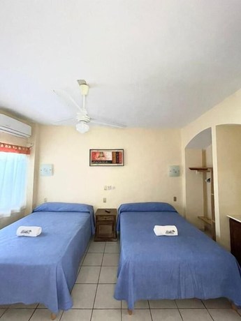 Imagen de la habitación del Hotel Ricardos Bungalows. Foto 7