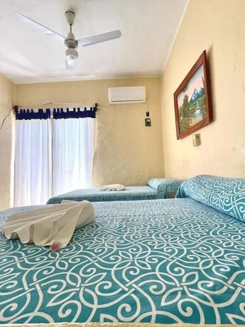 Imagen de la habitación del Hotel Ricardos Bungalows. Foto 8