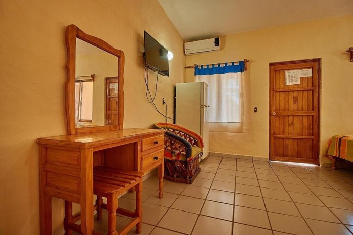 Imagen de la habitación del Hotel Ricardos Bungalows. Foto 16