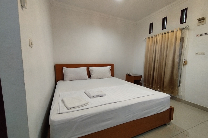 Imagen de la habitación del Hotel Rich Guesthouse. Foto 4