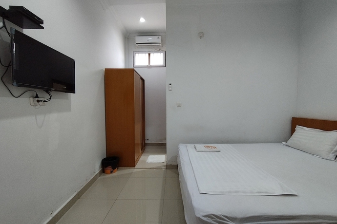 Imagen de la habitación del Hotel Rich Guesthouse. Foto 7