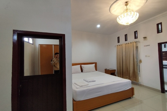 Imagen de la habitación del Hotel Rich Guesthouse. Foto 10