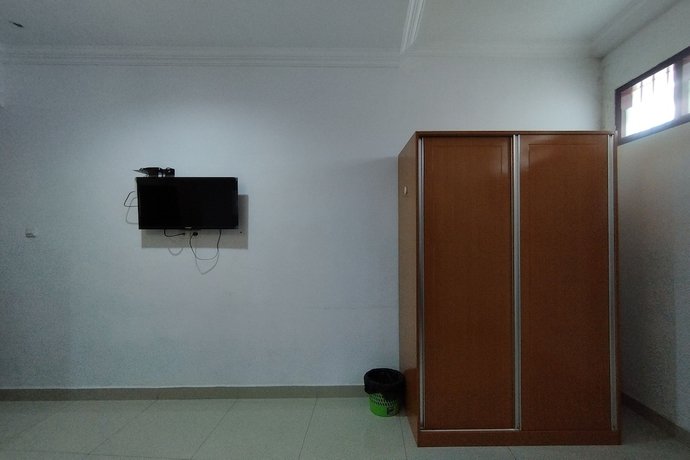 Imagen de la habitación del Hotel Rich Guesthouse. Foto 14