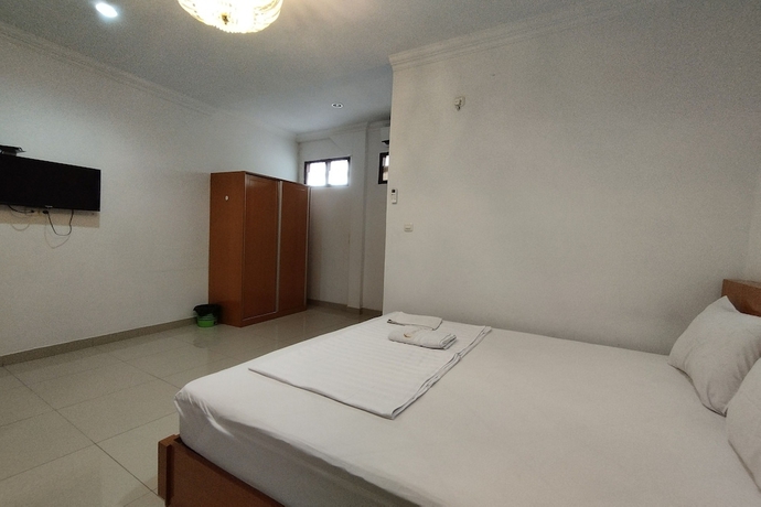 Imagen de la habitación del Hotel Rich Guesthouse. Foto 15