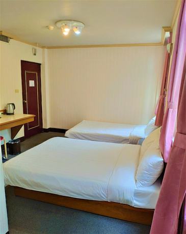 Imagen de la habitación del Hotel Rich Zone Hotel. Foto 7
