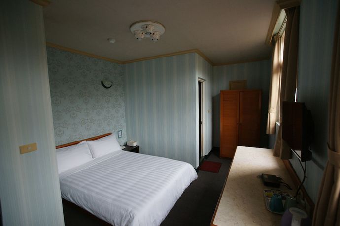 Imagen de la habitación del Hotel Rich Zone Hotel. Foto 13