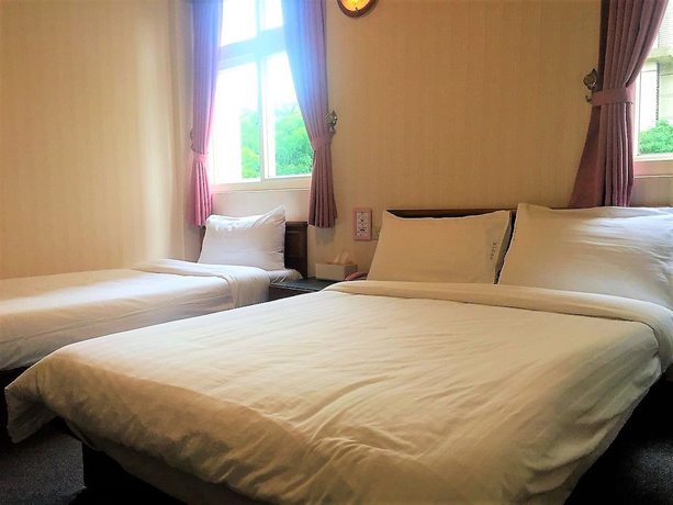 Imagen de la habitación del Hotel Rich Zone Hotel. Foto 14