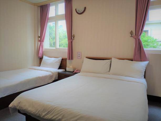 Imagen de la habitación del Hotel Rich Zone Hotel. Foto 15
