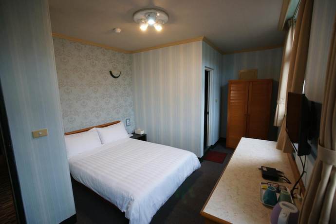 Imagen de la habitación del Hotel Rich Zone Hotel. Foto 16