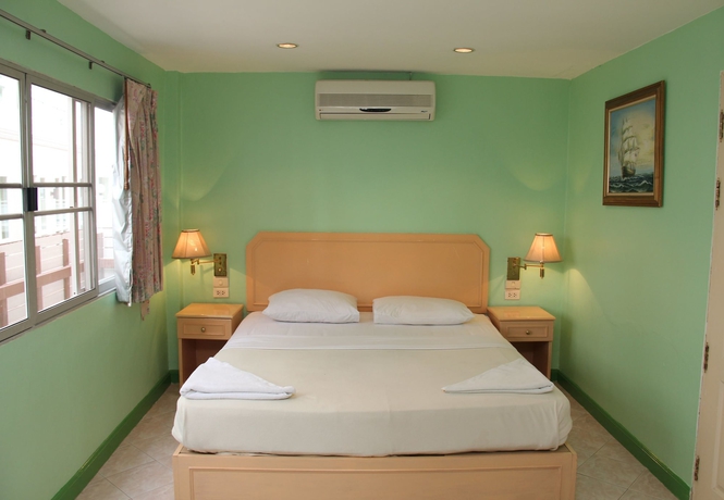Imagen de la habitación del Hotel Richman Poorman Guesthouse. Foto 2