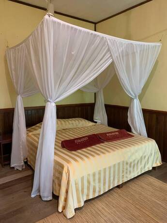 Imagen de la habitación del Hotel Rimba Orangutan Eco Lodge. Foto 17