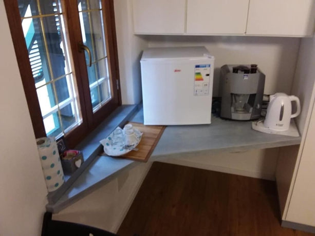 Imagen de la habitación del Hotel Rina Rooms. Foto 17