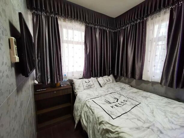 Imagen de la habitación del Hotel Ring Wood Guest House. Foto 20