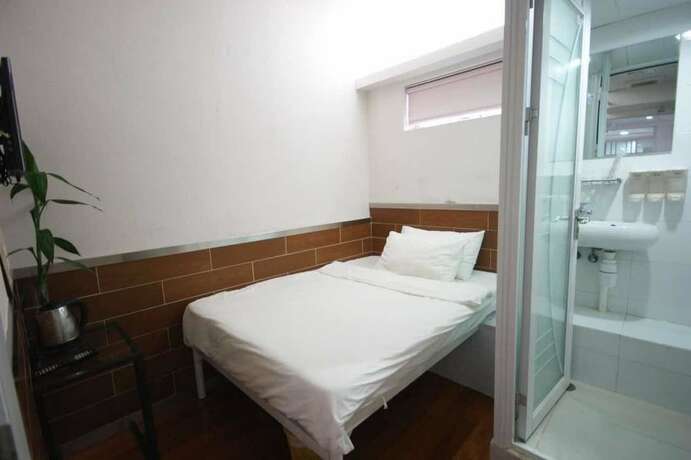 Imagen de la habitación del Hotel Ring Wood Guest House. Foto 23