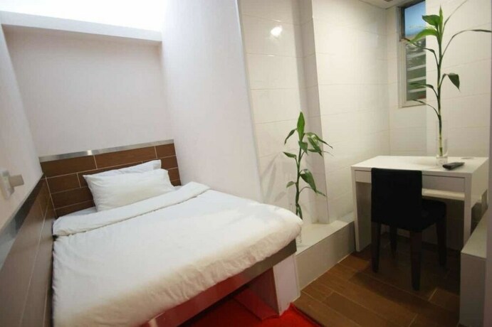 Imagen de la habitación del Hotel Ring Wood Guest House. Foto 32