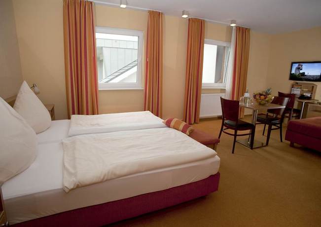 Imagen de la habitación del Hotel Ringhotel Alfsee Piazza. Foto 7