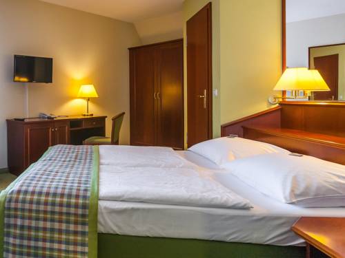 Imagen de la habitación del Hotel Ringhotel Warnem&uuml;nder Hof. Foto 9