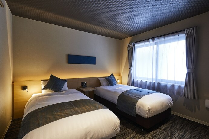 Imagen de la habitación del Hotel Rinn Higashi Otowa. Foto 9