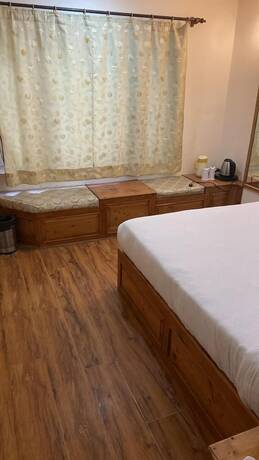 Imagen de la habitación del Hotel Rising Star. Foto 13