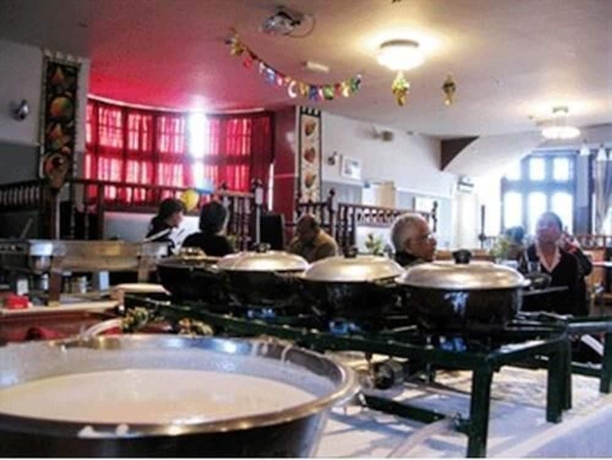 Imagen del bar/restaurante del Hotel Rising Sun Hotel. Foto 2