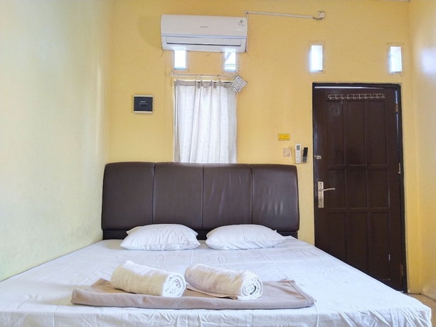 Imagen de la habitación del Hotel Risqia Homestay Syariah by Cocotel. Foto 6