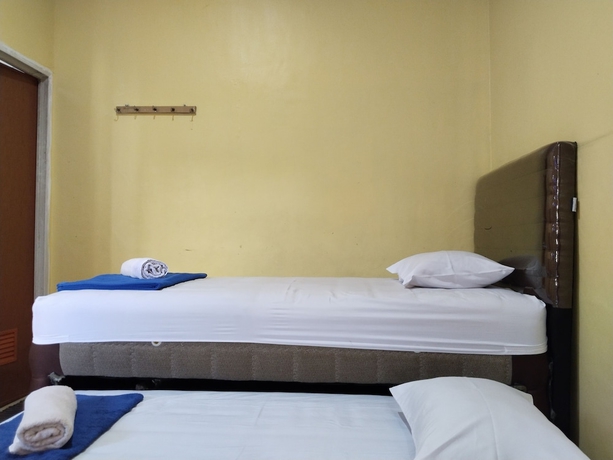 Imagen de la habitación del Hotel Risqia Homestay Syariah by Cocotel. Foto 9