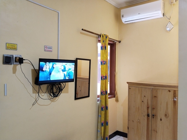 Imagen de la habitación del Hotel Risqia Homestay Syariah by Cocotel. Foto 10