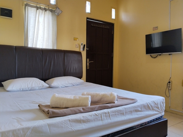 Imagen de la habitación del Hotel Risqia Homestay Syariah by Cocotel. Foto 11