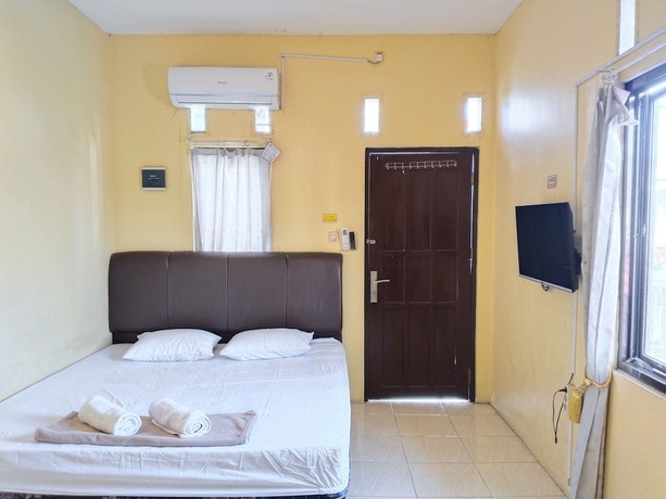 Imagen de la habitación del Hotel Risqia Homestay Syariah by Cocotel. Foto 12
