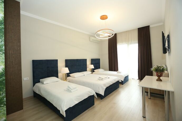 Imagen de la habitación del Hotel Rivendell Umbrella Collections. Foto 17