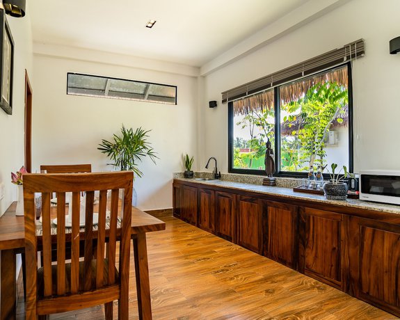Imagen de la habitación del Hotel RiverTree Villa and Resort. Foto 4