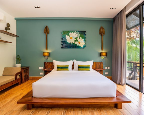 Imagen de la habitación del Hotel RiverTree Villa and Resort. Foto 11