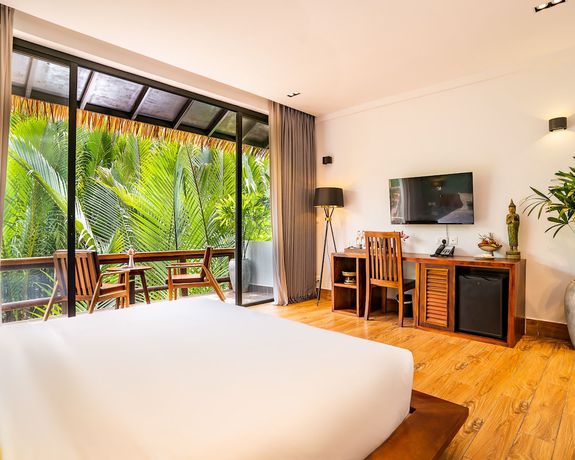 Imagen de la habitación del Hotel RiverTree Villa and Resort. Foto 15