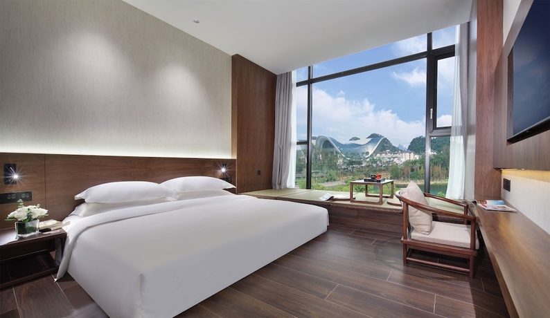 Imagen de la habitación del Hotel Riverside Wing Guilin. Foto 2