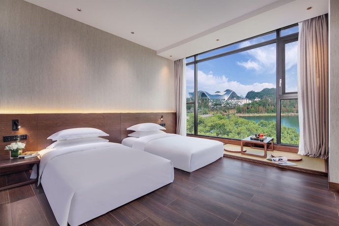Imagen de la habitación del Hotel Riverside Wing Guilin. Foto 10