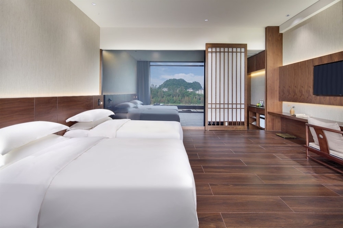 Imagen de la habitación del Hotel Riverside Wing Guilin. Foto 11