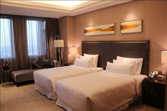Imagen de la habitación del Hotel Riviera Hotel - Ningbo. Foto 7