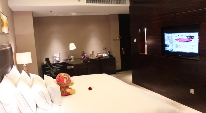 Imagen de la habitación del Hotel Riviera Hotel - Ningbo. Foto 9