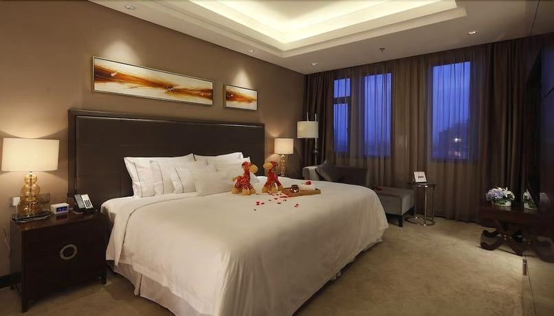 Imagen de la habitación del Hotel Riviera Ningbo. Foto 11