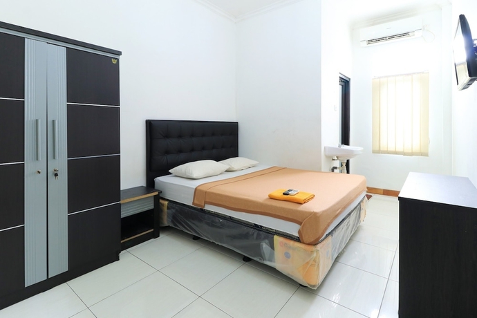 Imagen de la habitación del Hotel Riviera Residence, Balikpapan. Foto 11
