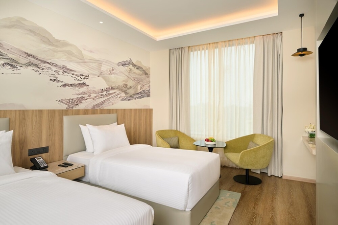 Imagen de la habitación del Hotel Riviera Sarovar Portico Pathankot. Foto 2
