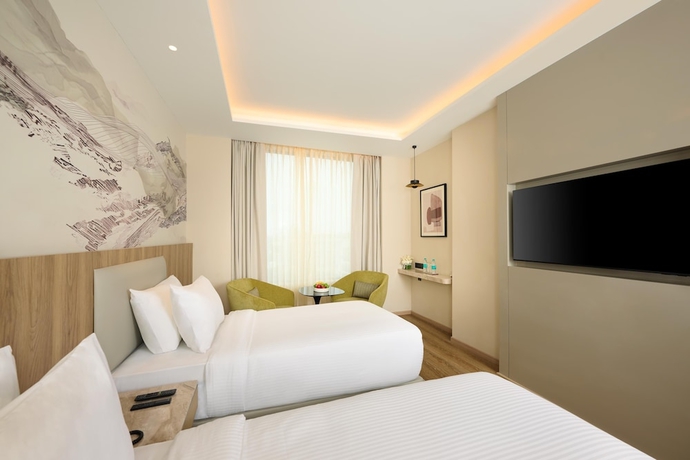 Imagen de la habitación del Hotel Riviera Sarovar Portico Pathankot. Foto 3