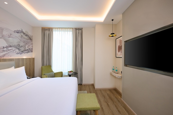 Imagen de la habitación del Hotel Riviera Sarovar Portico Pathankot. Foto 10