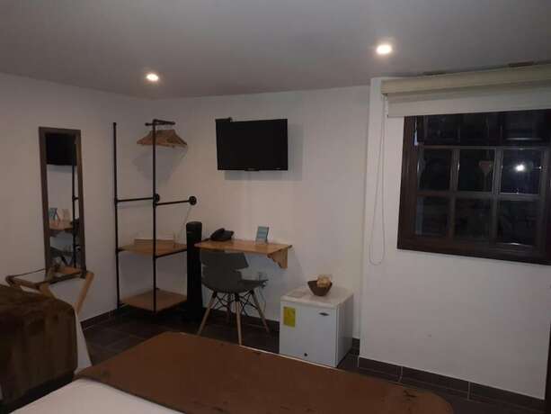 Imagen de la habitación del Hotel Riviere Boutique. Foto 16