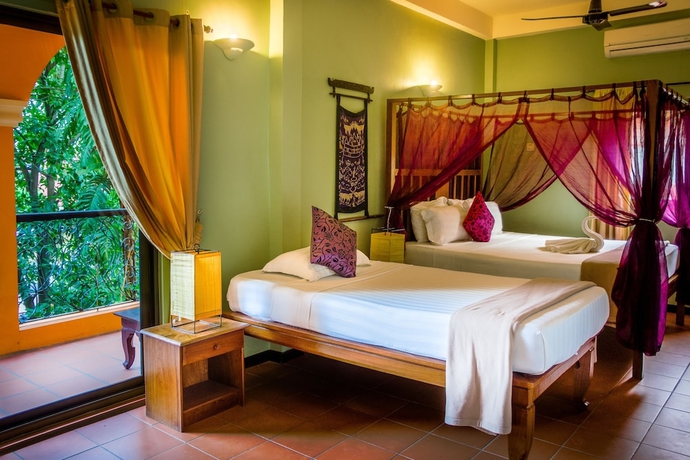 Imagen de la habitación del Hotel Robam Inn. Foto 11