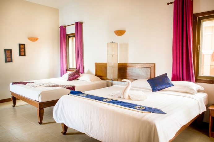 Imagen de la habitación del Hotel Robam Inn. Foto 14