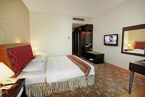 Imagen de la habitación del Hotel Rocky Plaza Hotel Padang. Foto 3